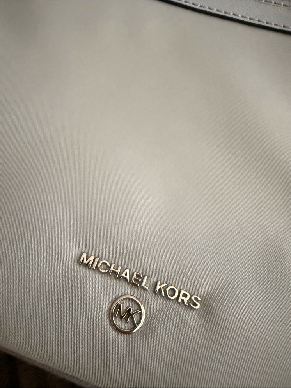 Handbag interior with Michael Kors tag